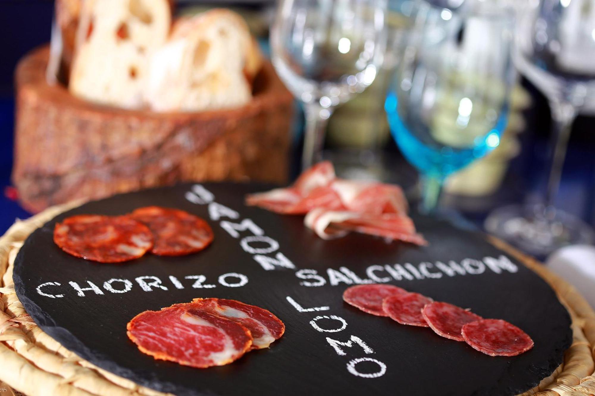 Centara Grand At Centralworld Bangkok Esterno foto A selection of cured meats